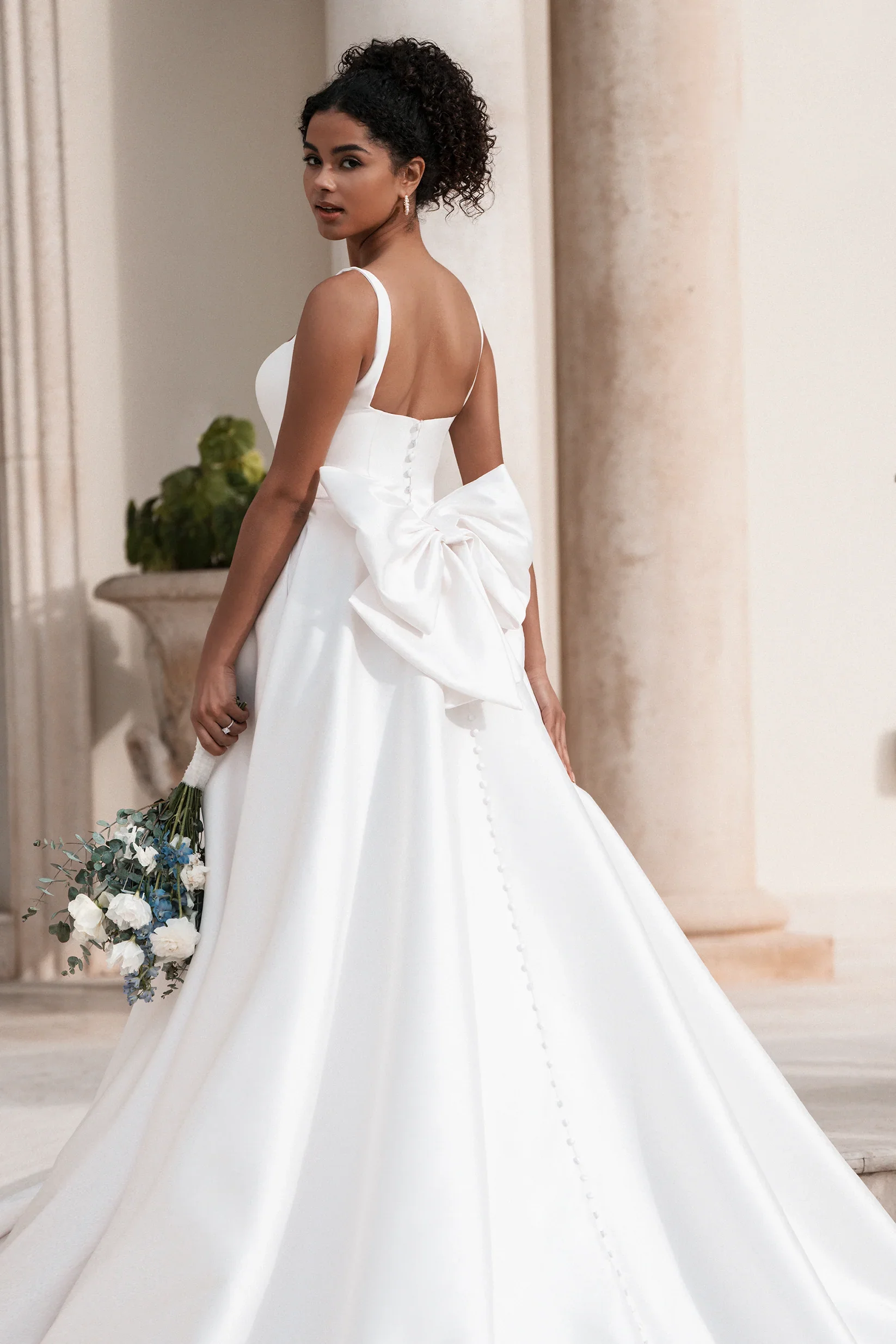 An Allure Bridals gown on the floor at RashawnRose in Davie, Florida